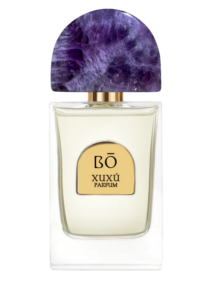 Perfume bottle with purple cap and gold label on a white background